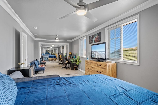 bedroom featuring multiple windows, ceiling fan, visible vents, and ornamental molding