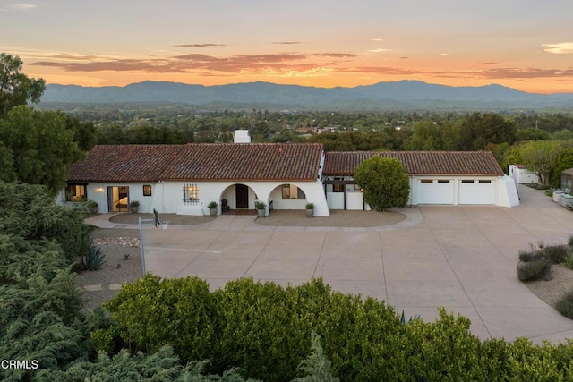 1270 Dove Meadow Rd, Solvang, CA 93463 - view of front of property featuring a chimney, a tiled roof, a mountain view, concrete driveway, and stucco siding