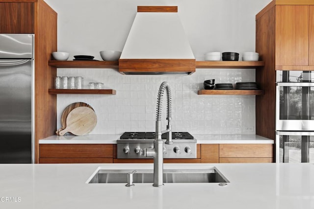 1270 Dove Meadow Rd, Solvang, CA 93463 - kitchen featuring appliances with stainless steel finishes, custom range hood, open shelves, light countertops, and decorative backsplash