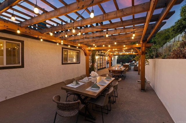 view of patio / terrace with fence, a pergola, and outdoor dining area