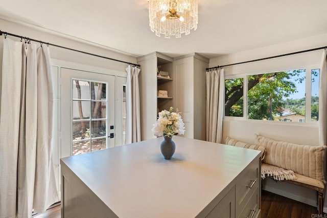 dining space featuring a chandelier and dark wood-style flooring