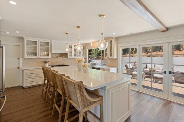 kitchen with dark wood-style flooring, recessed lighting, and light countertops