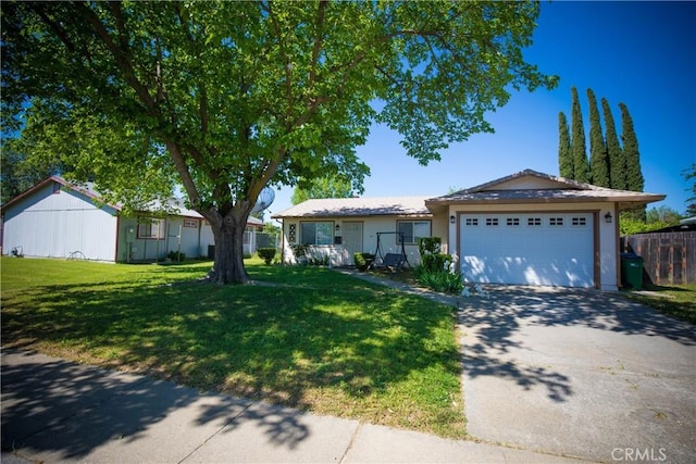 272 Rio Bravo Ct, Corning, CA 96021 - ranch-style home with a garage, driveway, a front yard, and fence