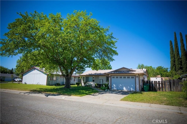 272 Rio Bravo Ct, Corning, CA 96021 - single story home with an attached garage, concrete driveway, a front lawn, and fence