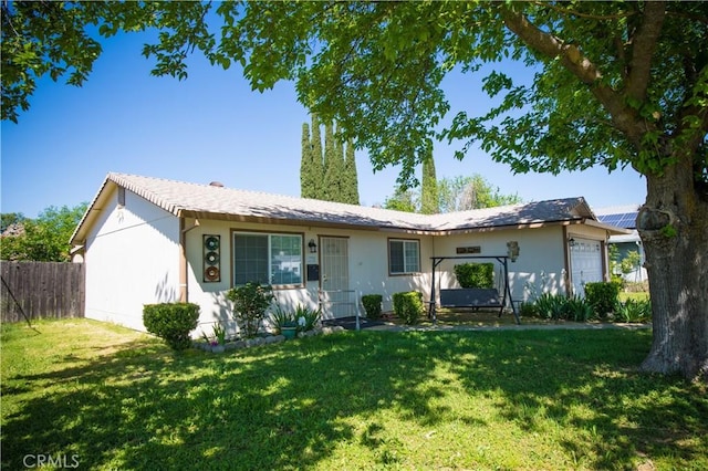 272 Rio Bravo Ct, Corning, CA 96021 - ranch-style house featuring stucco siding, fence, a garage, and a front yard