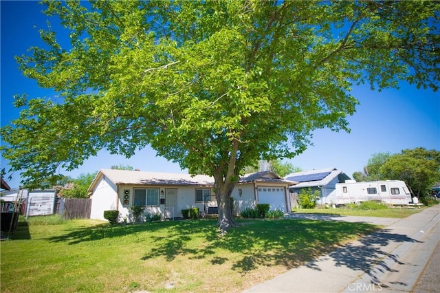 272 Rio Bravo Ct, Corning, CA 96021 - view of front of property with an attached garage, driveway, fence, and a front lawn