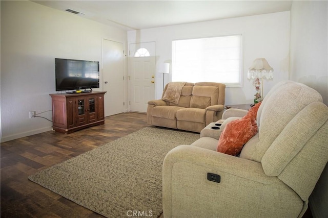 272 Rio Bravo Ct, Corning, CA 96021 - living area featuring visible vents, baseboards, a healthy amount of sunlight, and dark wood-style flooring
