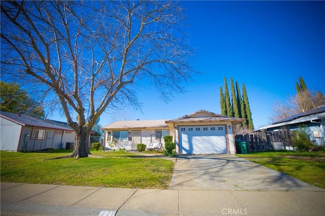 272 Rio Bravo Ct, Corning, CA 96021 - ranch-style house featuring concrete driveway, a front lawn, fence, and a garage