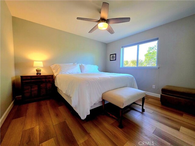 47180 Lookout Mountain Dr, Coarsegold, CA 93614 - bedroom with wood-type flooring, baseboards, and a ceiling fan