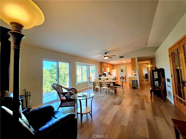 47180 Lookout Mountain Dr, Coarsegold, CA 93614 - living area featuring light wood-style floors, a ceiling fan, and vaulted ceiling