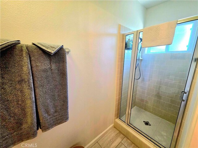 47180 Lookout Mountain Dr, Coarsegold, CA 93614 - bathroom featuring a shower stall, baseboards, and tile patterned floors