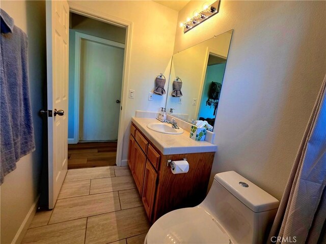 47180 Lookout Mountain Dr, Coarsegold, CA 93614 - bathroom featuring vanity, tile patterned floors, toilet, and baseboards