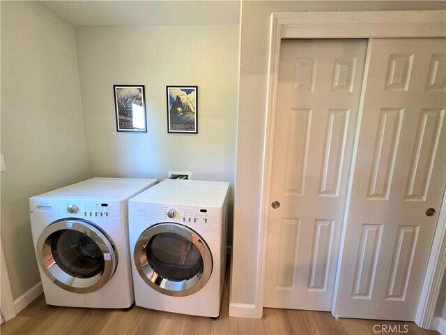 47180 Lookout Mountain Dr, Coarsegold, CA 93614 - washroom featuring independent washer and dryer, light wood-style flooring, and baseboards