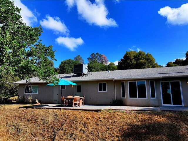47180 Lookout Mountain Dr, Coarsegold, CA 93614 - rear view of property with stucco siding, central AC, and a patio area