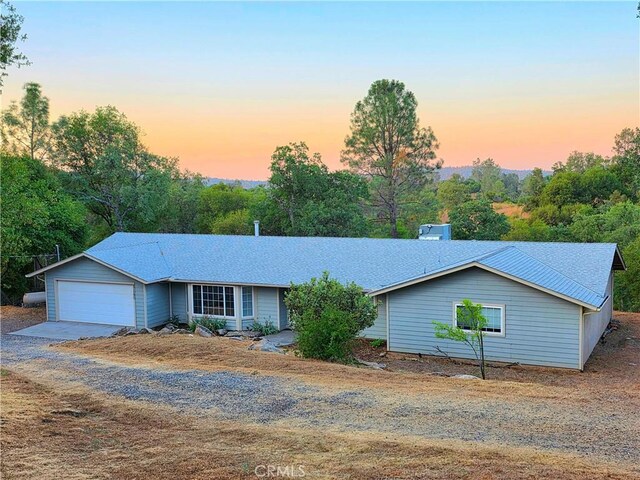 47180 Lookout Mountain Dr, Coarsegold, CA 93614 - single story home with gravel driveway, a garage, and a shingled roof