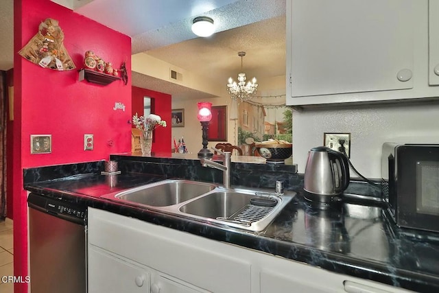 kitchen with dishwasher, a sink, white cabinets, a chandelier, and dark countertops