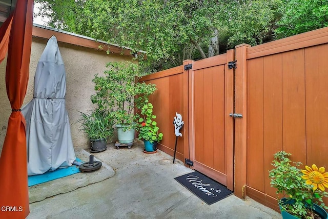 view of outbuilding with a gate and fence