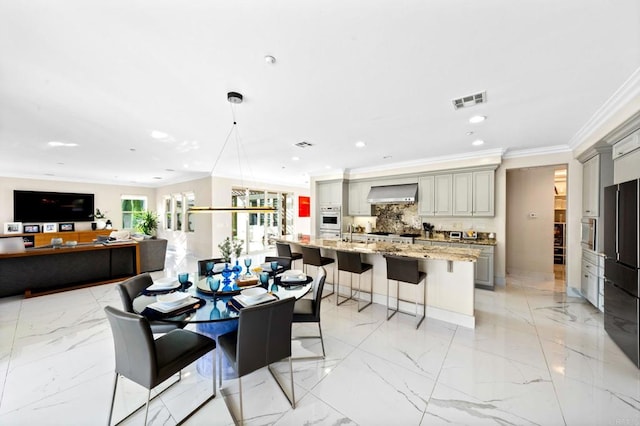 dining room featuring marble finish floor, crown molding, visible vents, and recessed lighting