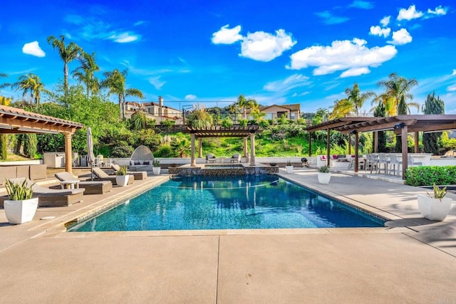 view of swimming pool featuring a pergola, a pool with connected hot tub, area for grilling, and a patio