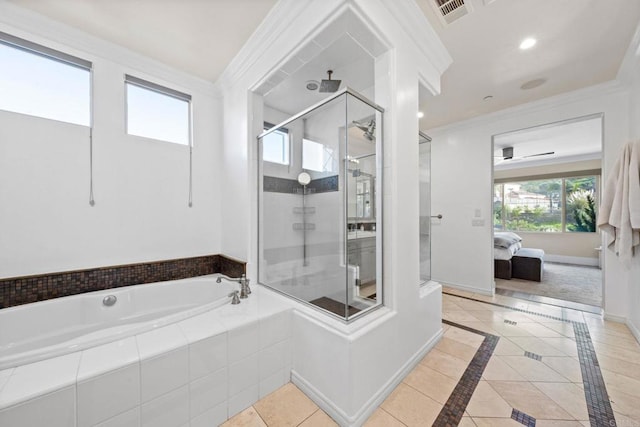 ensuite bathroom with a shower stall, crown molding, baseboards, a garden tub, and ensuite bathroom