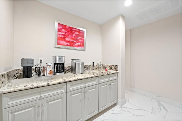 bar featuring recessed lighting, marble finish floor, and baseboards
