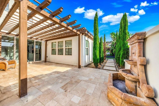 view of patio featuring a pergola