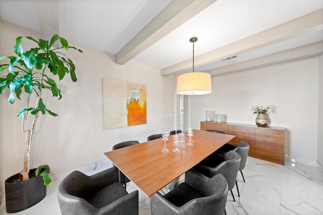 dining area with marble finish floor, visible vents, and beamed ceiling