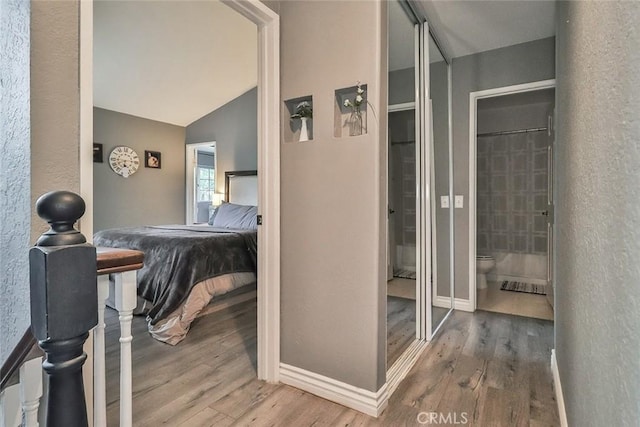 415 Jeremiah Dr Unit B, Simi Valley, CA 93065 - bathroom featuring lofted ceiling, wood finished floors, toilet, and baseboards