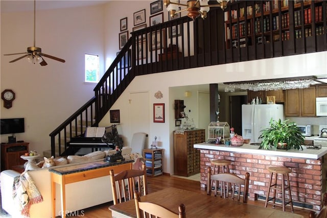 4746 Egret Ln, Paso Robles, CA 93446 - interior space with wood finished floors, ceiling fan, stairs, and a towering ceiling