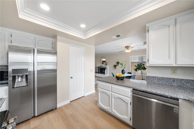 kitchen with ceiling fan, visible vents, appliances with stainless steel finishes, light wood-type flooring, and white cabinetry