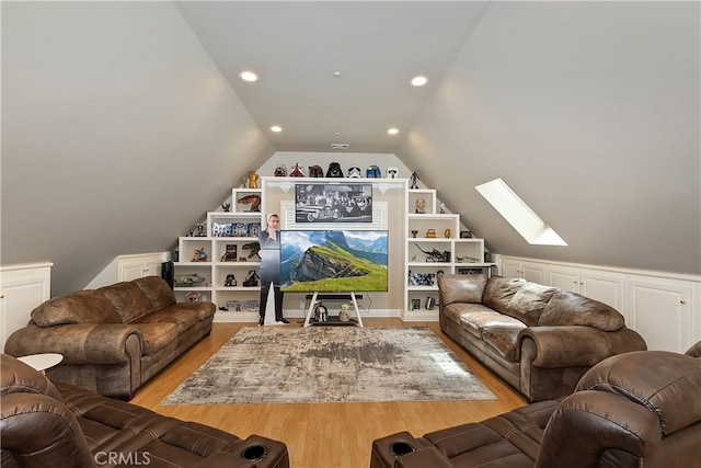 1010 Black Oaks Dr, Lake Arrowhead, CA 92352 - living room featuring recessed lighting, vaulted ceiling with skylight, light wood-style flooring, and built in features
