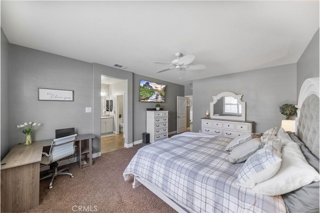 carpeted bedroom with visible vents, ceiling fan, and ensuite bathroom