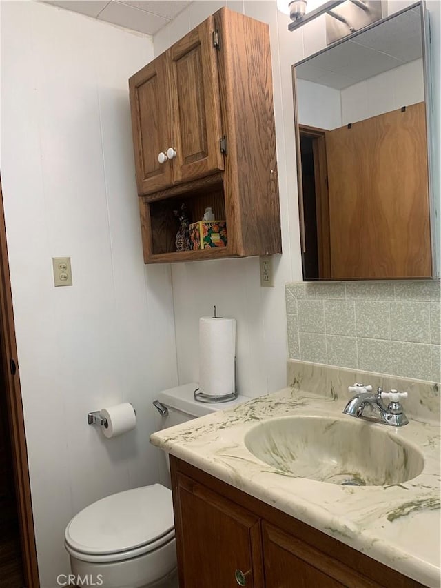 33010 Juniper Ln, Green Valley Lake, CA 92341 - bathroom featuring toilet, vanity, and tasteful backsplash