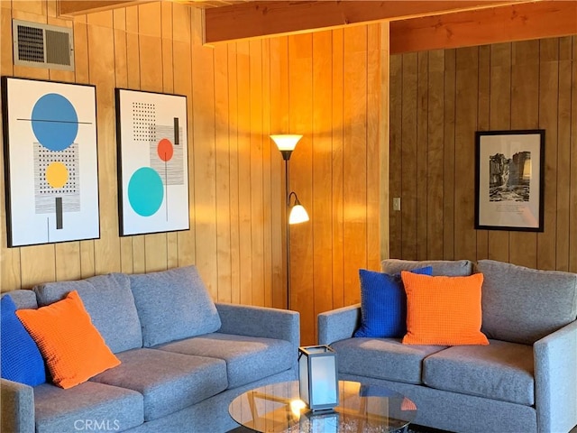 33010 Juniper Ln, Green Valley Lake, CA 92341 - living room featuring beamed ceiling, wooden walls, and visible vents