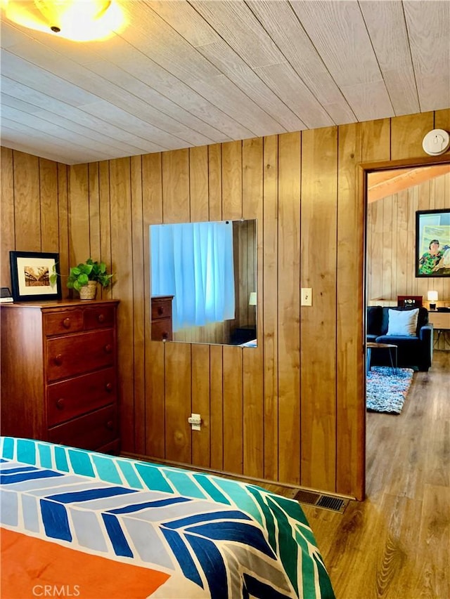 33010 Juniper Ln, Green Valley Lake, CA 92341 - bedroom with wooden ceiling, wood walls, and wood finished floors