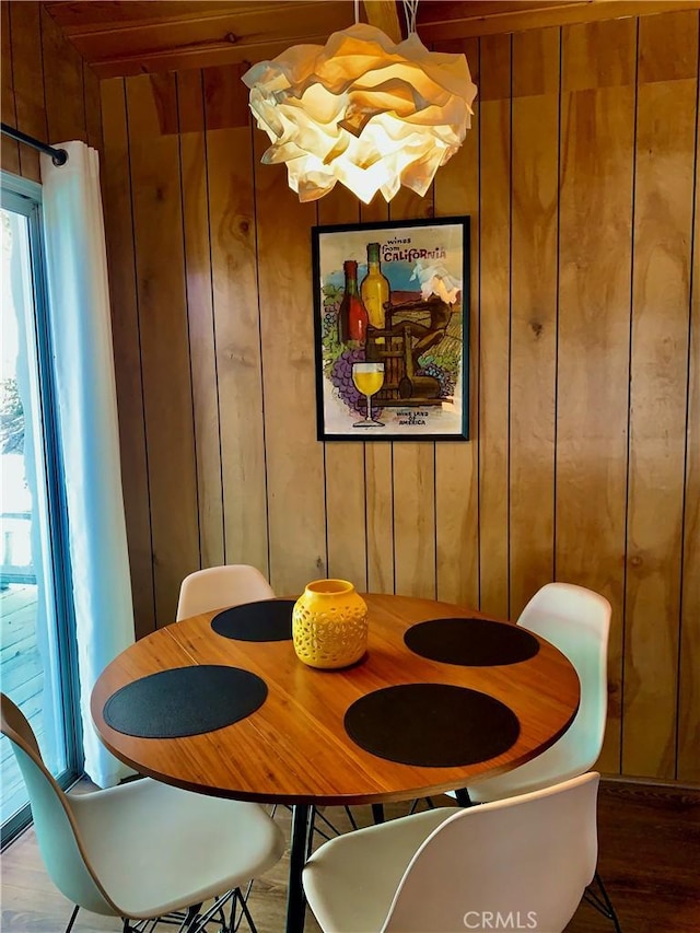 33010 Juniper Ln, Green Valley Lake, CA 92341 - dining room featuring wood walls, wood finished floors, and an inviting chandelier