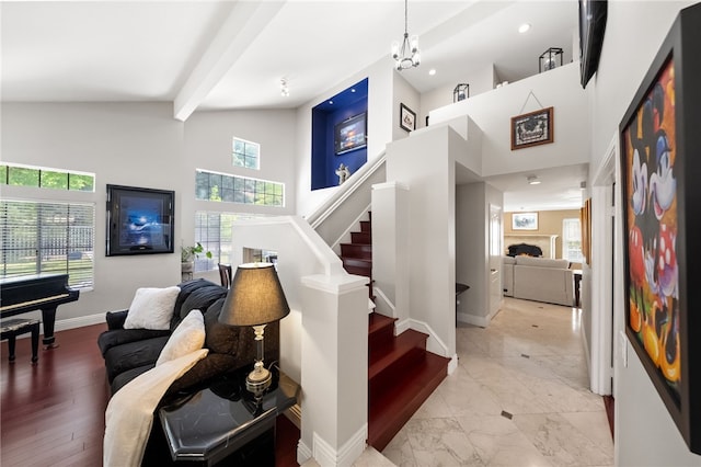 1441 San Almada Rd, Corona, CA 92882 - stairs with a healthy amount of sunlight, high vaulted ceiling, a warm lit fireplace, and baseboards
