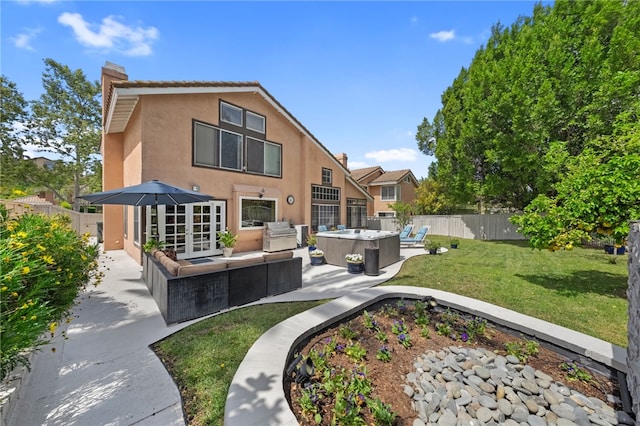 1441 San Almada Rd, Corona, CA 92882 - back of house featuring a patio, a yard, a fenced backyard, outdoor lounge area, and stucco siding