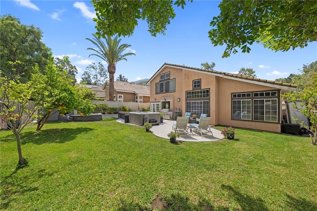 1441 San Almada Rd, Corona, CA 92882 - back of property with a patio, a fenced backyard, stucco siding, and a yard