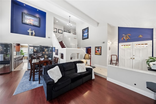 1441 San Almada Rd, Corona, CA 92882 - living area featuring beam ceiling, high vaulted ceiling, dark wood-type flooring, stairs, and baseboards