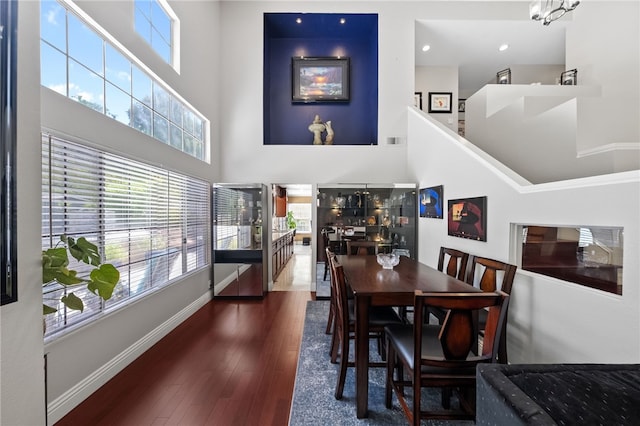1441 San Almada Rd, Corona, CA 92882 - dining space featuring wood finished floors, plenty of natural light, baseboards, and a high ceiling