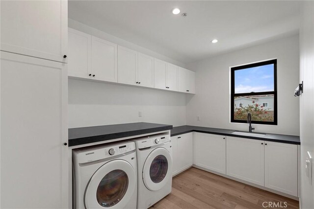 1311 18th St, Manhattan Beach, CA 90266 - washroom featuring independent washer and dryer, recessed lighting, light wood-style floors, and cabinet space