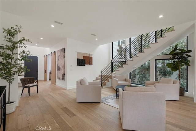 1311 18th St, Manhattan Beach, CA 90266 - living area with stairs, light wood-style floors, recessed lighting, and a barn door