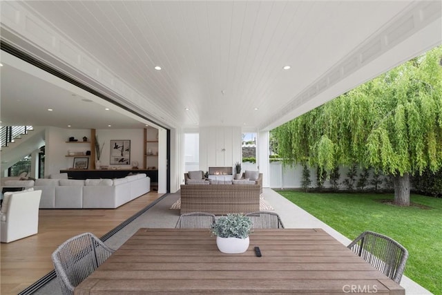 dining space featuring wood ceiling, wood finished floors, and recessed lighting