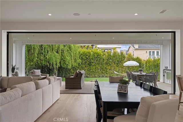 interior space with light wood-style floors and recessed lighting