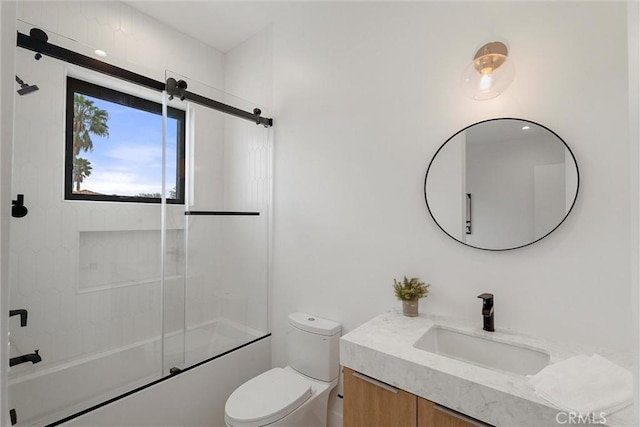 full bathroom with vanity, shower / bath combination with glass door, and toilet