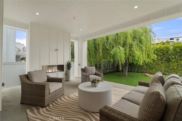 view of patio / terrace featuring an outdoor living space with a fireplace