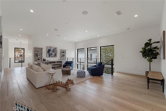 1311 18th St, Manhattan Beach, CA 90266 - living room with light wood-style flooring, recessed lighting, and a chandelier