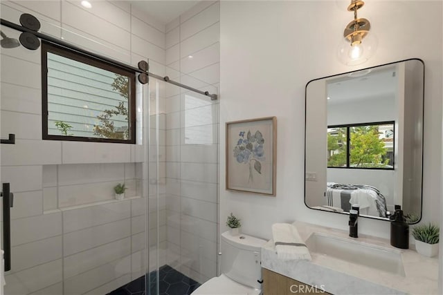 ensuite bathroom featuring ensuite bath, vanity, a shower stall, and toilet