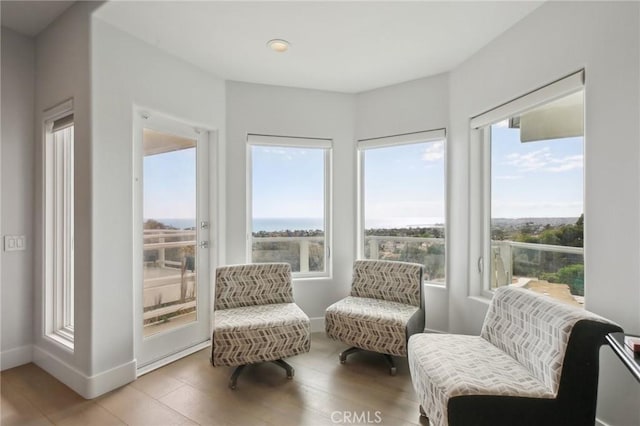 interior space featuring baseboards, recessed lighting, and wood finished floors